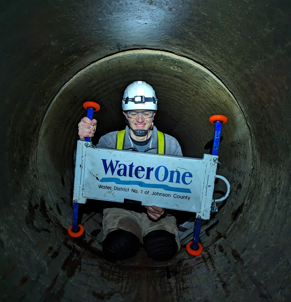 Employee inside of pipe